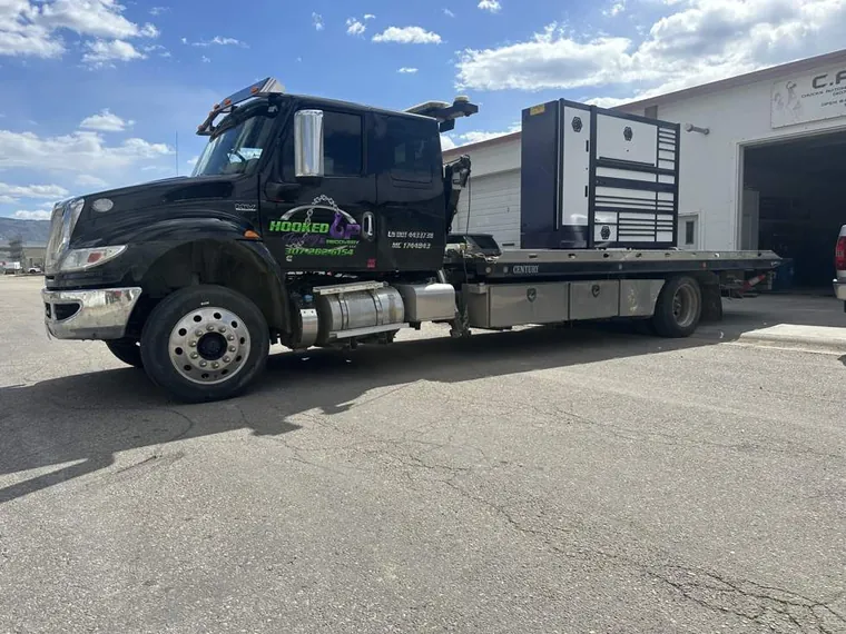 Full-size shop tool box moved on flatbed tow truck in Casper WY