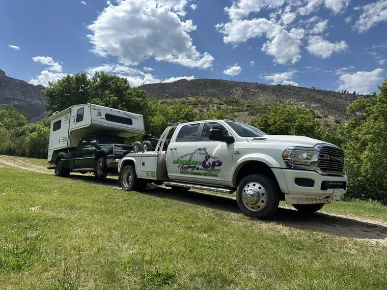 Truck camper recovery in the Wyoming mountains by Hooked Up Towing and Recovery